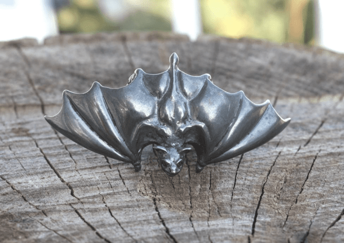 irc black silver bat wing ring with ruby eyes